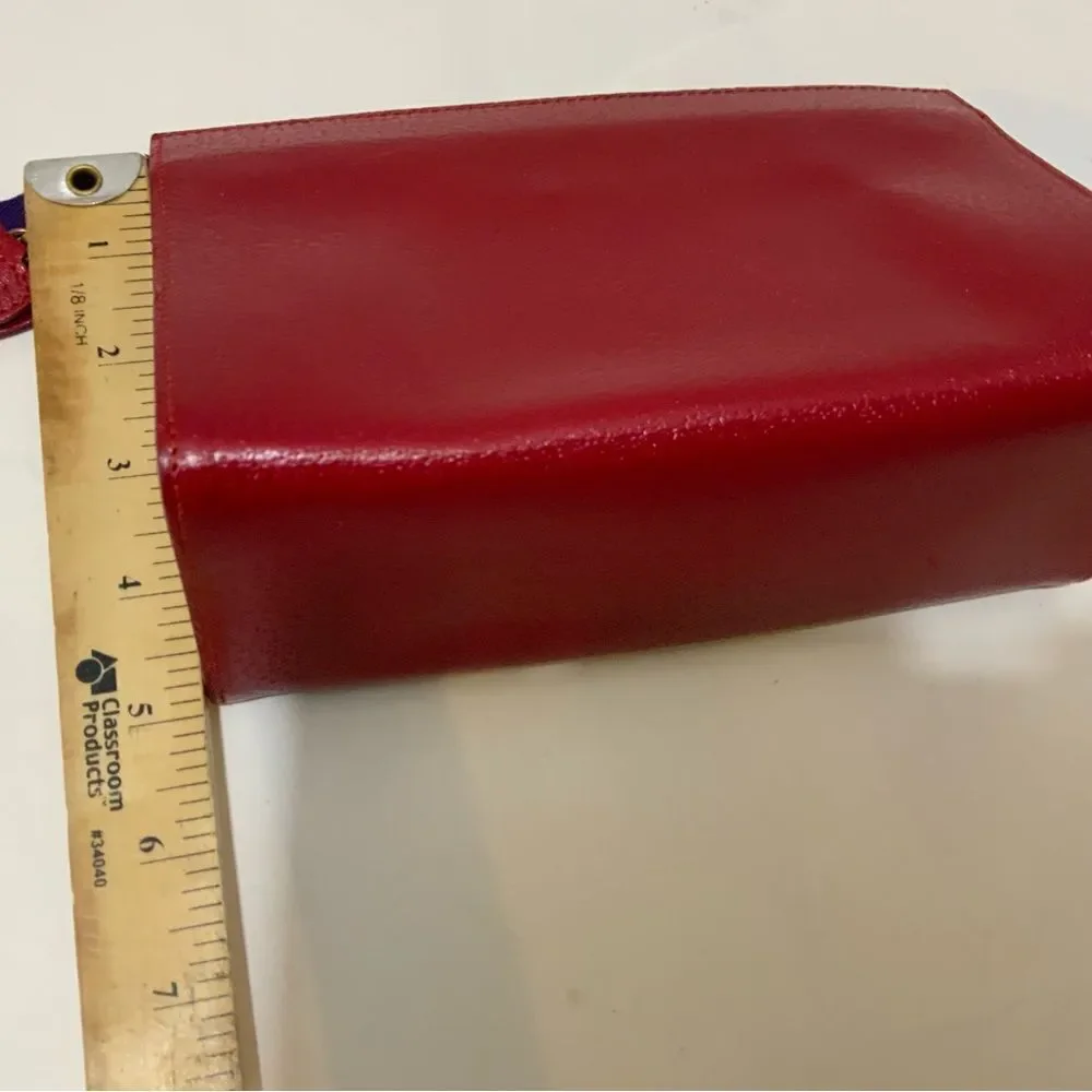 NWOT Aspinal of London red reptile cosmetic case.